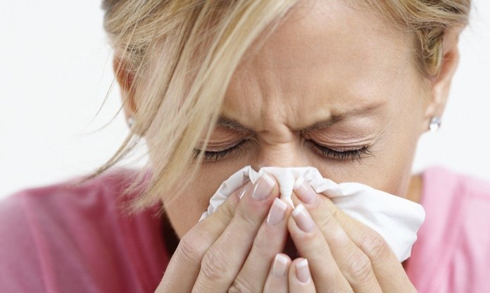 Woman Sneezing
